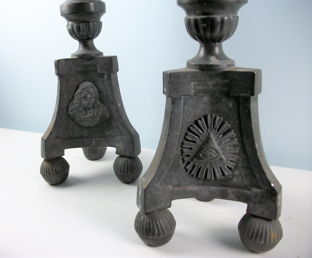 a pair of pewter candlesticks